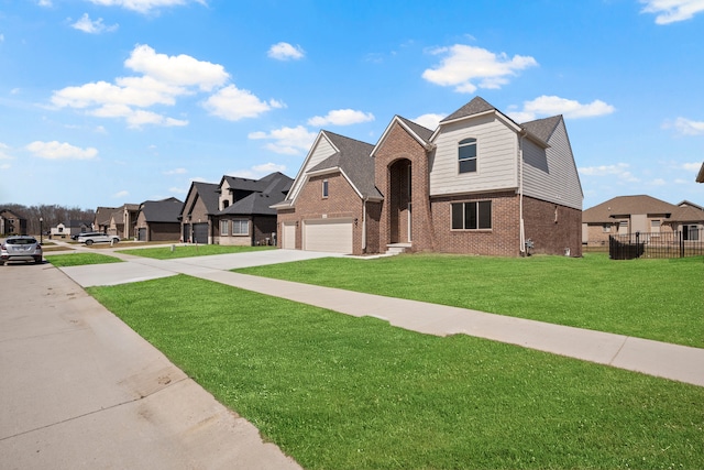 35689 Windridge Dr, New Baltimore, MI 48047 - view of front of home with a residential view, fence, brick siding, a front yard, and concrete driveway