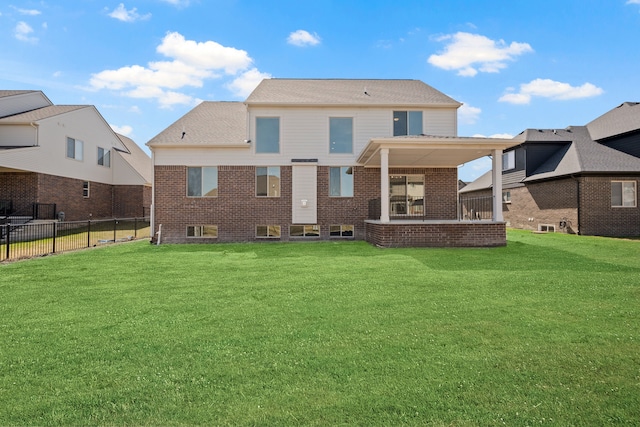 35689 Windridge Dr, New Baltimore, MI 48047 - rear view of property with a lawn, fence, and brick siding