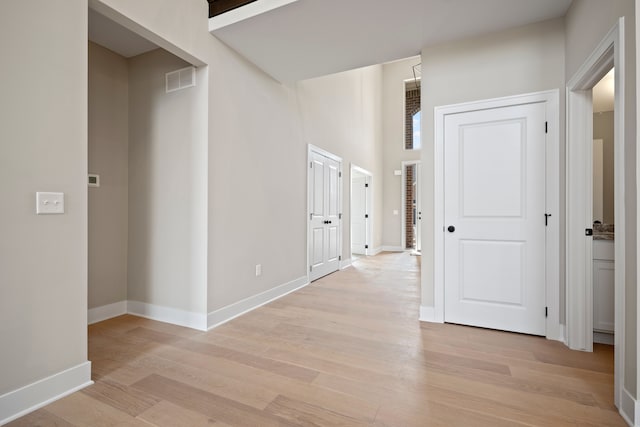 35689 Windridge Dr, New Baltimore, MI 48047 - hall featuring light wood-style floors, baseboards, and visible vents