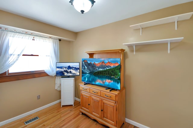 bedroom with visible vents, baseboards, and light wood-style flooring