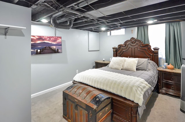 bedroom featuring baseboards and light colored carpet