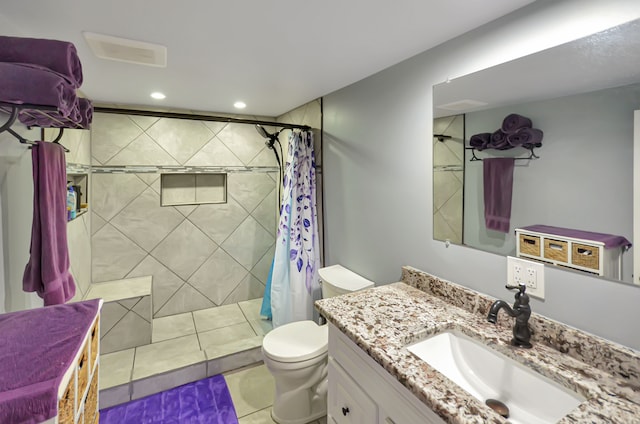 bathroom featuring tile patterned flooring, toilet, recessed lighting, tiled shower, and vanity