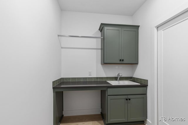 8123 Byron Depot Dr SW, Byron Center, MI 49315 - laundry area with a sink and light wood-style flooring
