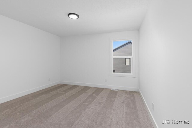 8123 Byron Depot Dr SW, Byron Center, MI 49315 - spare room with baseboards and light carpet