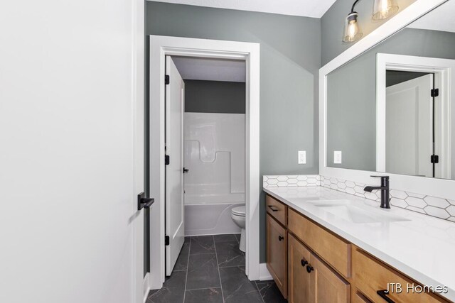 8123 Byron Depot Dr SW, Byron Center, MI 49315 - full bath with marble look tiles, vanity, and toilet