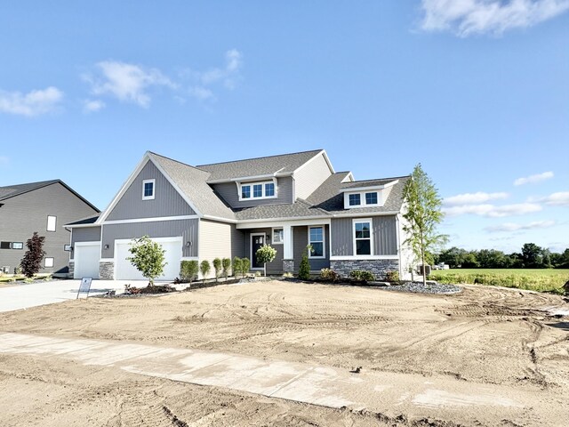 8123 Byron Depot Dr SW, Byron Center, MI 49315 - craftsman inspired home with stone siding, driveway, and roof with shingles