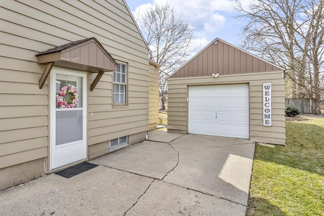 detached garage featuring driveway