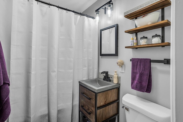 full bath featuring toilet and vanity