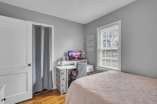 bedroom featuring light wood-style floors