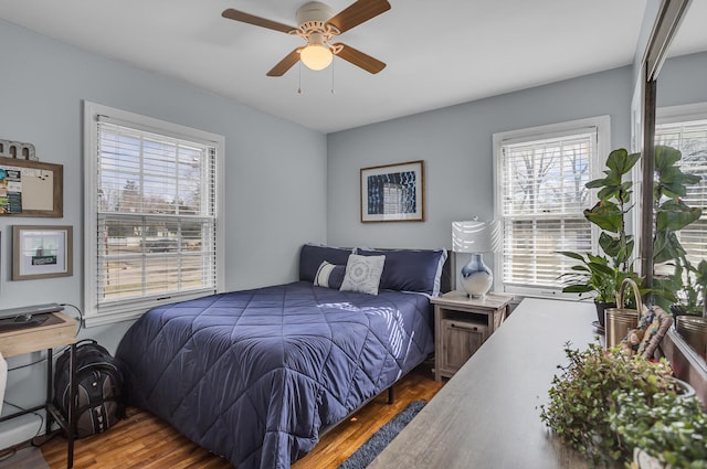 bedroom featuring ceiling fan and wood finished floors