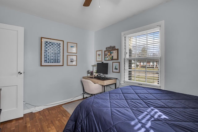 bedroom with a ceiling fan and wood finished floors