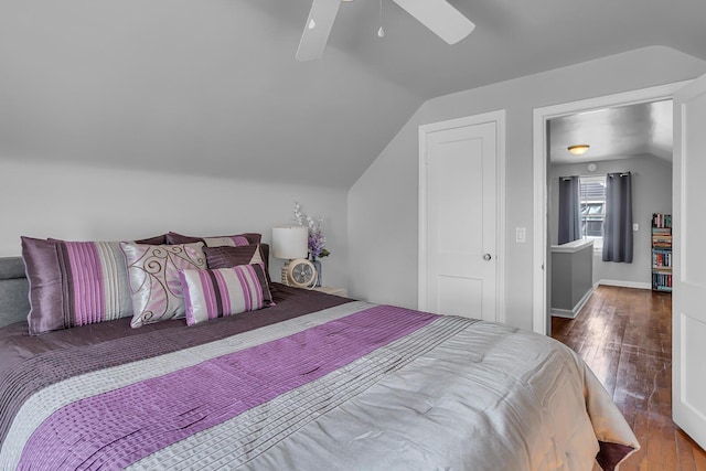 bedroom featuring vaulted ceiling, hardwood / wood-style floors, and ceiling fan