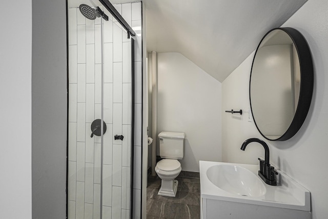 full bath with vaulted ceiling, vanity, a shower stall, and toilet