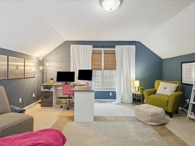 carpeted home office with lofted ceiling and baseboards