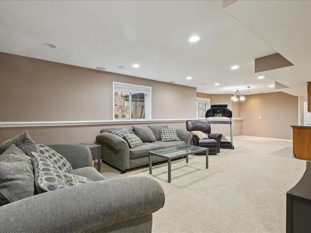 living area with recessed lighting, baseboards, and light colored carpet