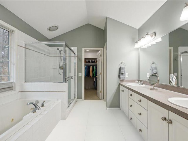 full bath featuring double vanity, a stall shower, a sink, vaulted ceiling, and a bath