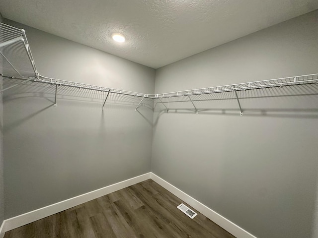 2653 Mclaughlin Ave, Muskegon, MI 49442 - walk in closet featuring dark wood-type flooring and visible vents