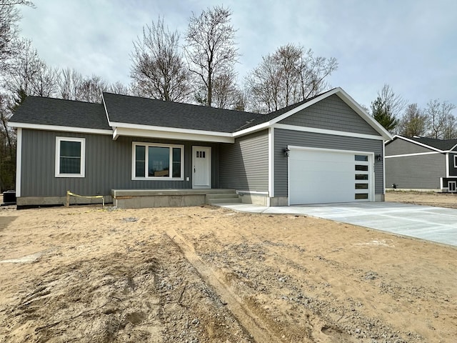 2653 Mclaughlin Ave, Muskegon, MI 49442 - single story home featuring a garage, covered porch, and concrete driveway