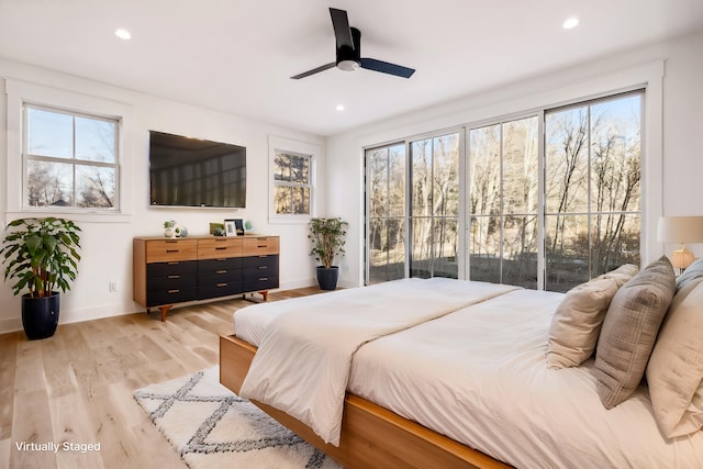 bedroom with baseboards, recessed lighting, a ceiling fan, and light wood-style floors