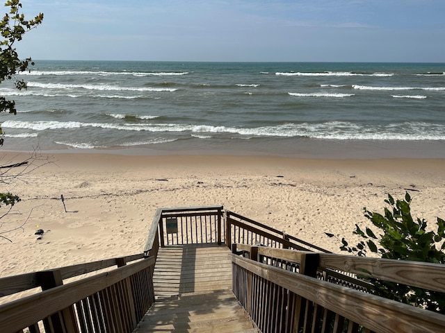 view of community with a water view and a view of the beach