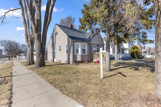 view of property exterior featuring a residential view and a lawn