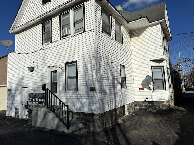 exterior space featuring entry steps and cooling unit