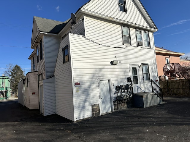 back of house featuring fence