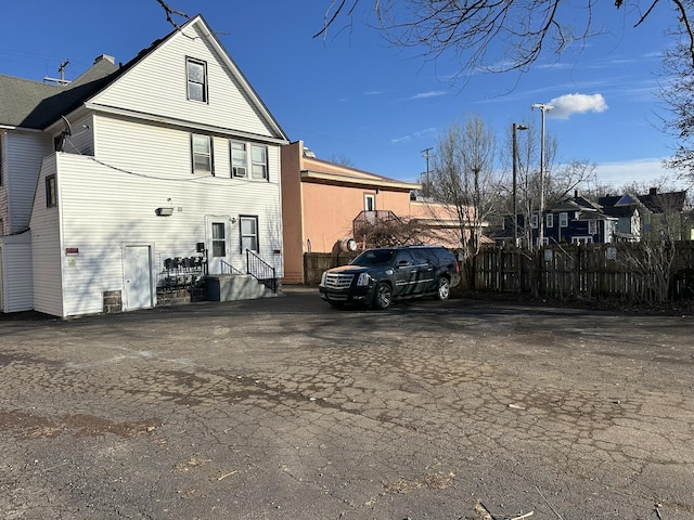 rear view of property with fence