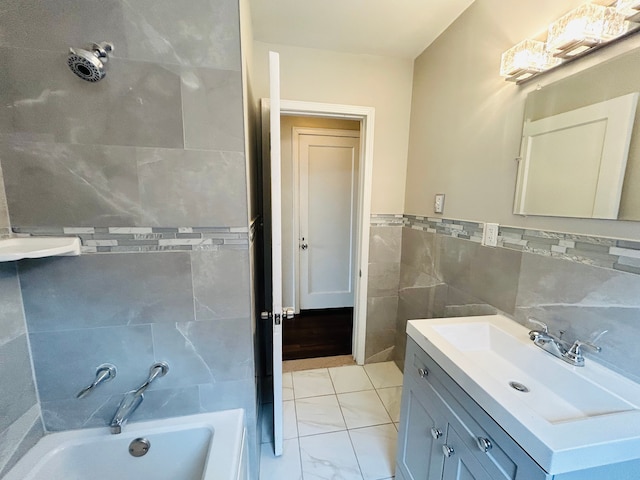 full bathroom with wainscoting, tile walls, vanity, and a bath