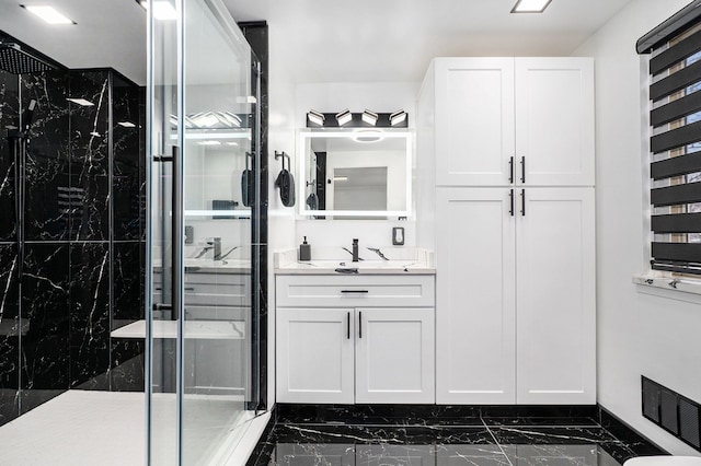 full bath with marble finish floor, visible vents, vanity, and a marble finish shower