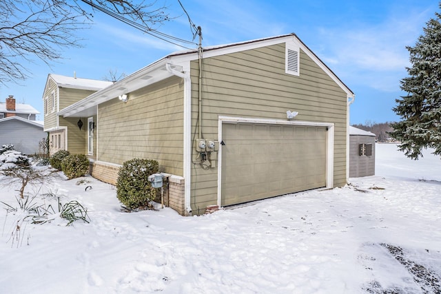 view of snow covered garage