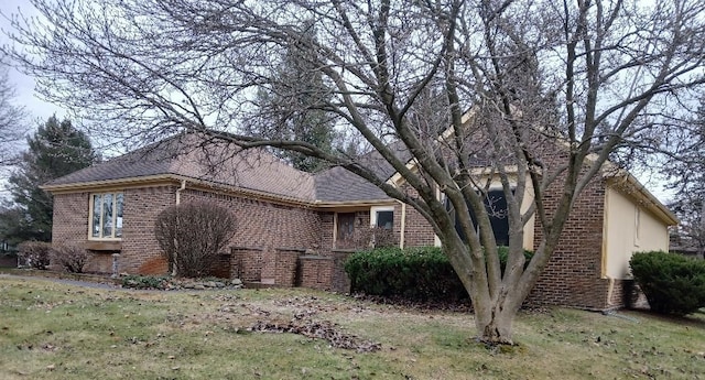 view of home's exterior featuring brick siding