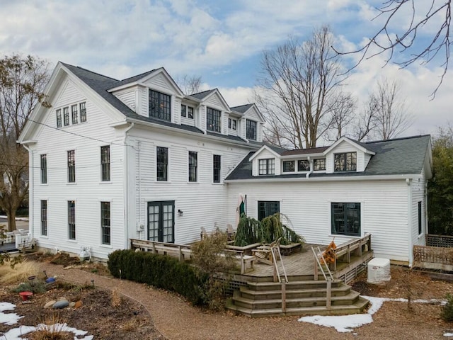 view of front facade with a wooden deck