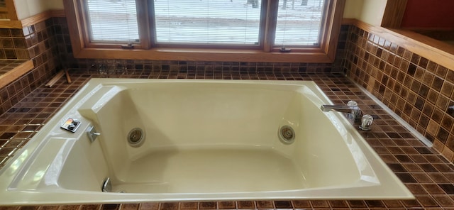 3075 Mineral Springs Trl, Mount Pleasant, MI 48858 - bathroom featuring plenty of natural light, backsplash, and a whirlpool tub