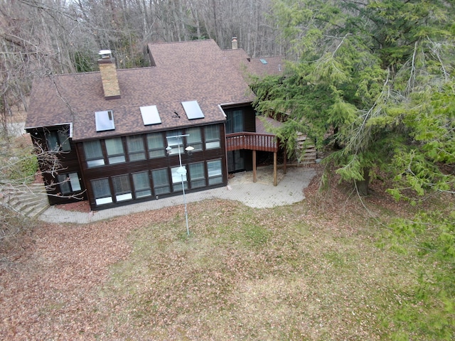 3075 Mineral Springs Trl, Mount Pleasant, MI 48858 - back of house with a chimney and a shingled roof