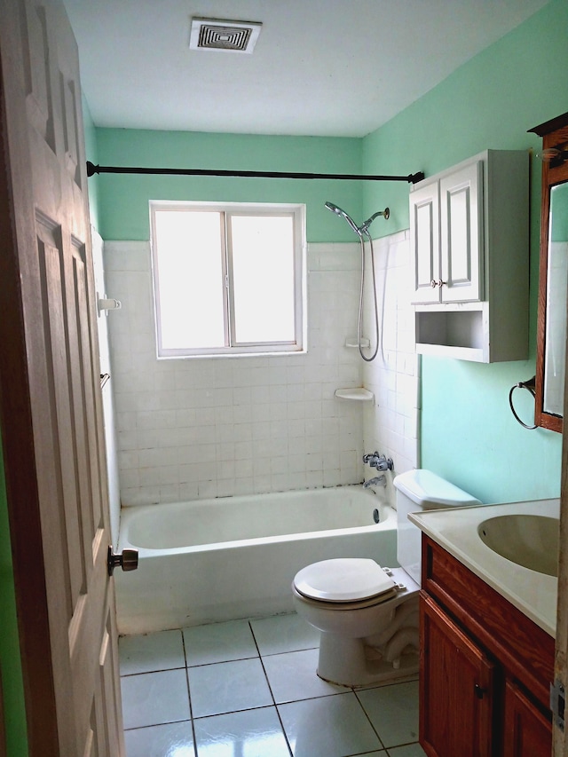 bathroom with tile patterned flooring, visible vents, shower / washtub combination, toilet, and vanity