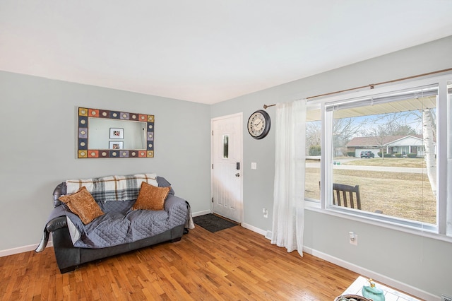 interior space featuring wood finished floors and baseboards