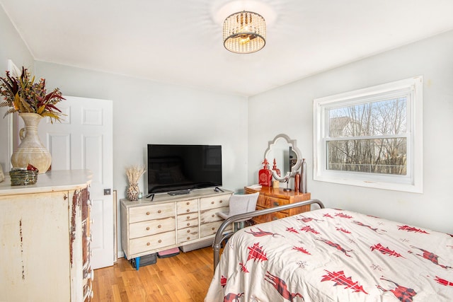 bedroom featuring light wood-style floors