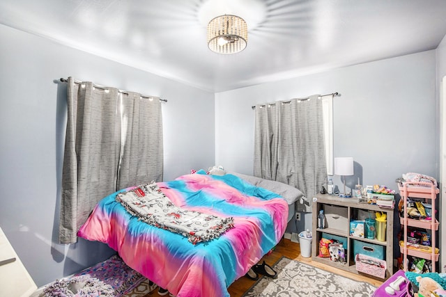 bedroom with wood finished floors