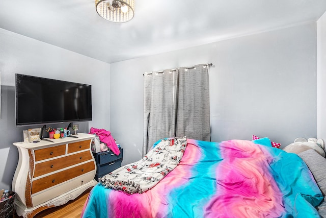 bedroom featuring wood finished floors