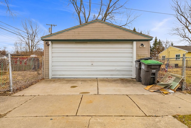 detached garage featuring fence