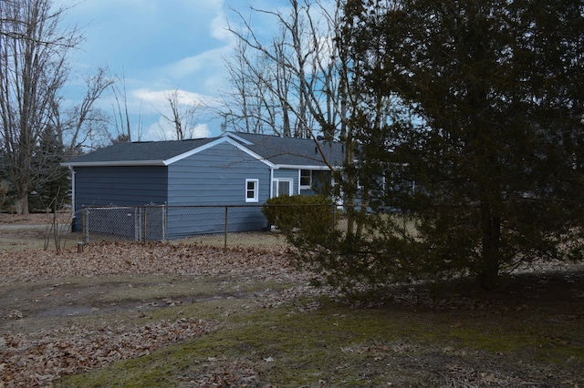 view of property exterior with fence