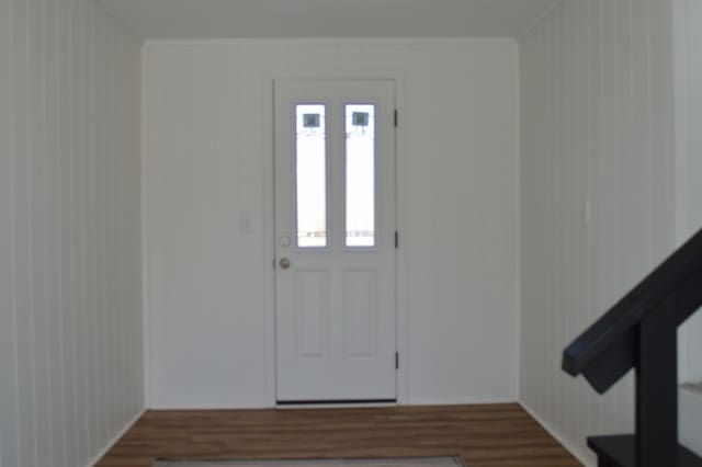 foyer featuring wood finished floors