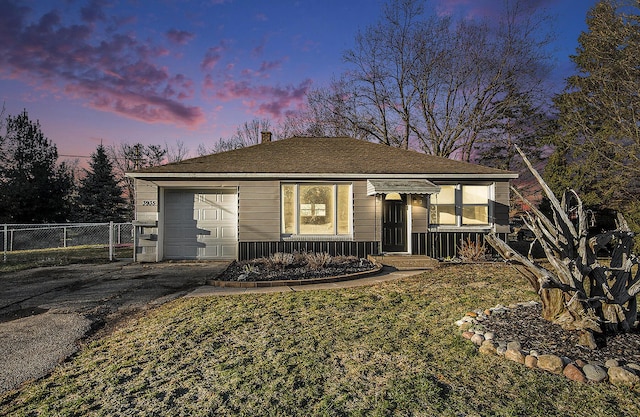 single story home with an attached garage, fence, driveway, a gate, and a chimney