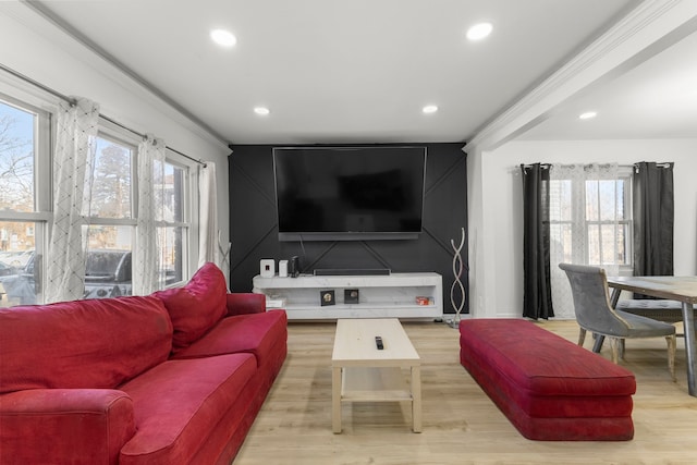 living room with recessed lighting, a healthy amount of sunlight, and light wood-type flooring