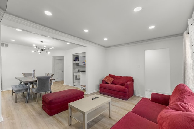 living area with visible vents, recessed lighting, an inviting chandelier, and light wood-style floors