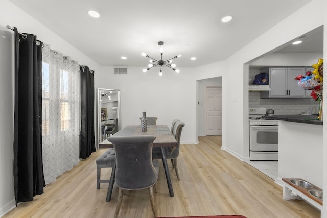 dining room with visible vents, recessed lighting, and light wood-type flooring