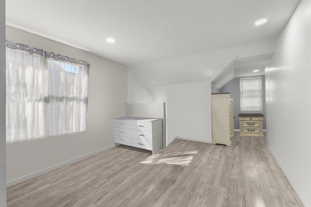 bonus room featuring lofted ceiling, recessed lighting, light wood-style floors, and baseboards