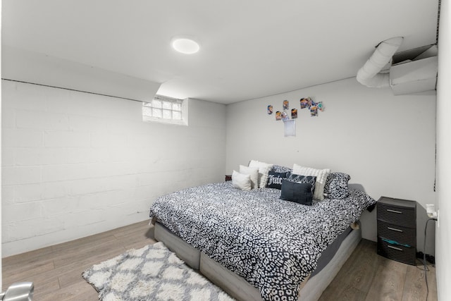 bedroom featuring wood finished floors