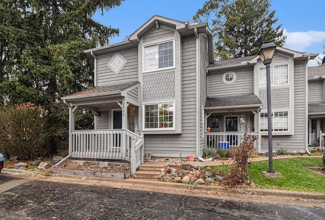 traditional home featuring covered porch